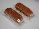 Empacado de productos de pastelería en charola en flow pack