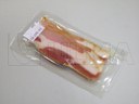 Empacado de bacon en termoformado al vacío en film flexible
