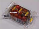 Empacado de charola con tomate cherry en flow pack