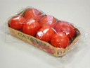 Empacado de charolas con tomate en flow pack